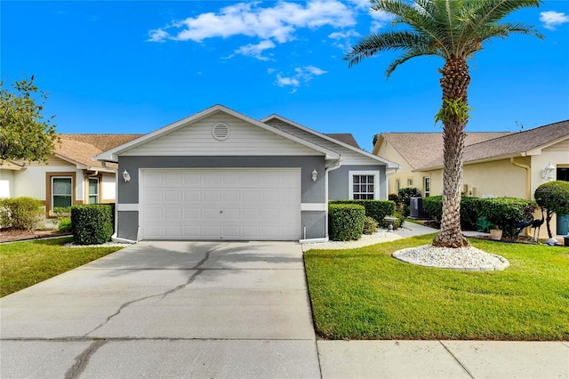 ranch-style home featuring a front lawn and a garage