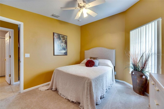 bedroom featuring ceiling fan and light colored carpet