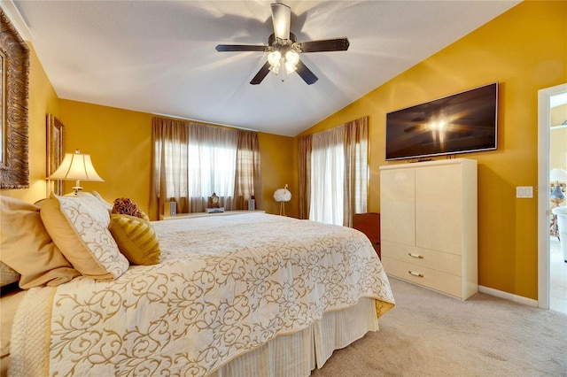 carpeted bedroom with ceiling fan and lofted ceiling