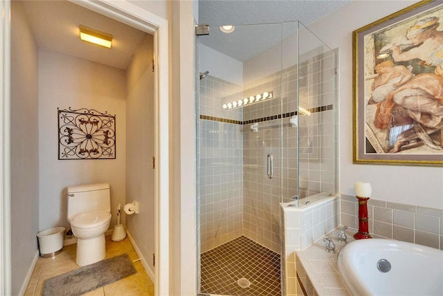 bathroom with tile patterned floors, toilet, and separate shower and tub