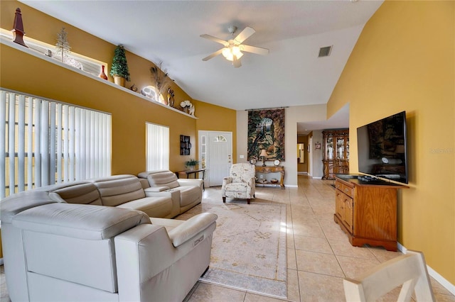 living room featuring ceiling fan, light tile patterned floors, and high vaulted ceiling