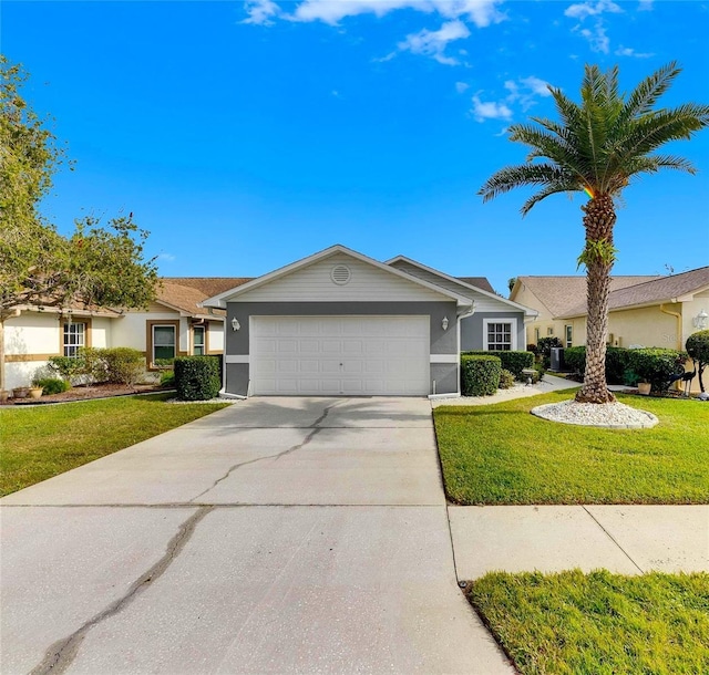 single story home with a front lawn and a garage