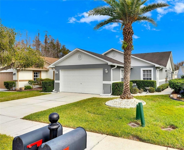 single story home featuring a front lawn and a garage