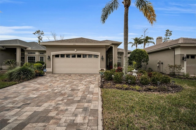 view of front facade featuring a front yard and a garage