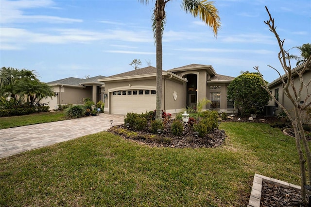 view of front of property featuring a garage and a front lawn