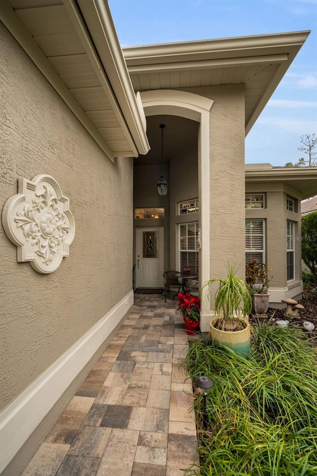 property entrance featuring a patio