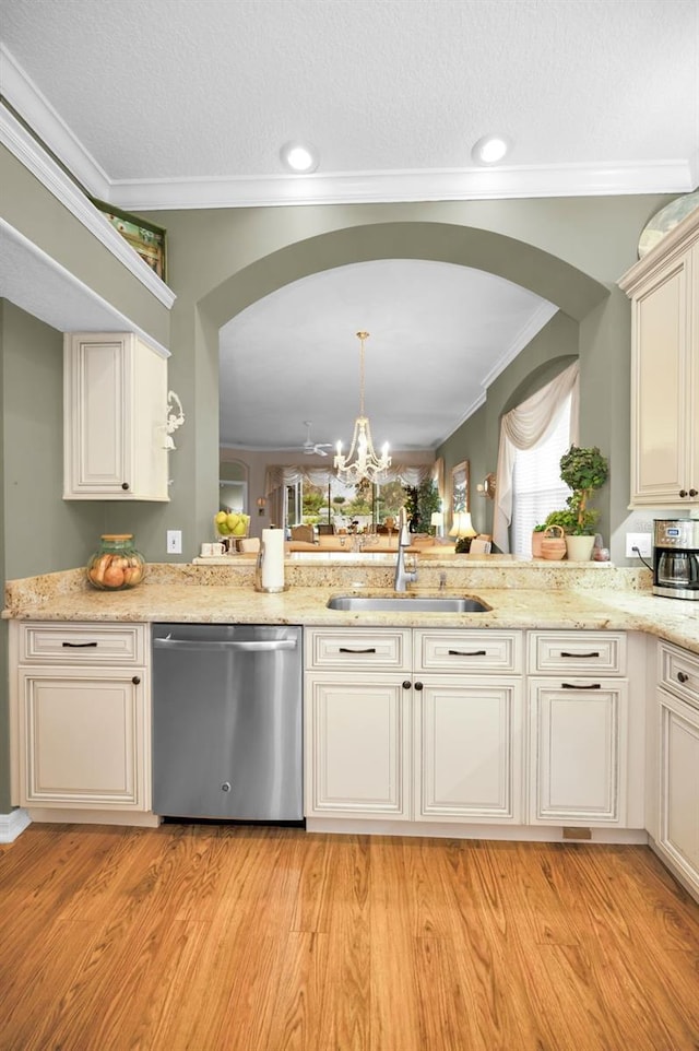 kitchen with ornamental molding, a chandelier, pendant lighting, stainless steel dishwasher, and sink