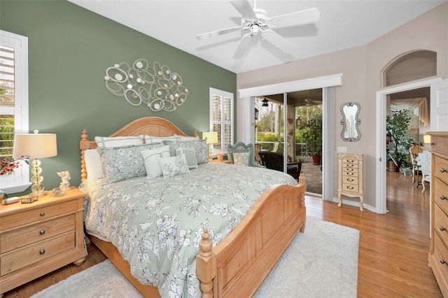 bedroom featuring ceiling fan, light hardwood / wood-style flooring, and access to outside