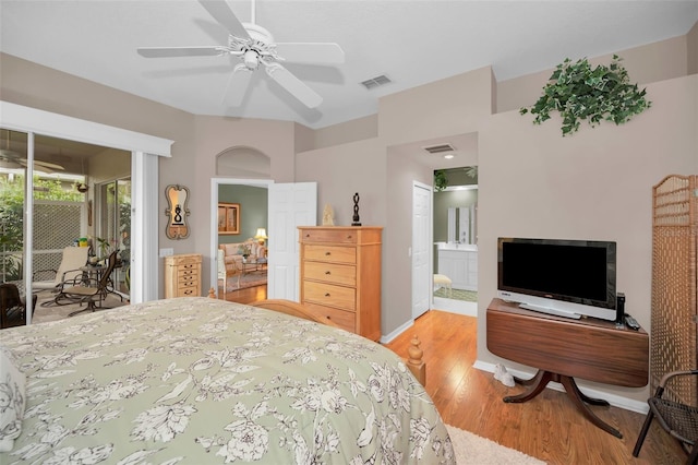 bedroom with access to outside, ensuite bath, ceiling fan, and light wood-type flooring