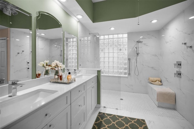 bathroom featuring vanity and tiled shower