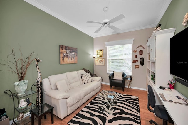 living room featuring light hardwood / wood-style floors, ornamental molding, and ceiling fan