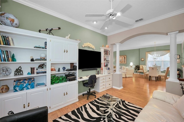 office area with decorative columns, ceiling fan with notable chandelier, crown molding, and light hardwood / wood-style floors