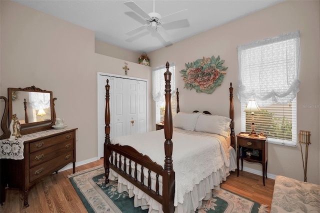 bedroom featuring ceiling fan, a closet, and wood-type flooring