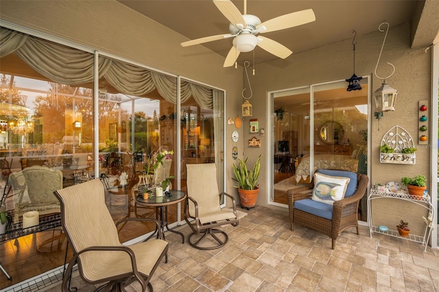 exterior space featuring ceiling fan