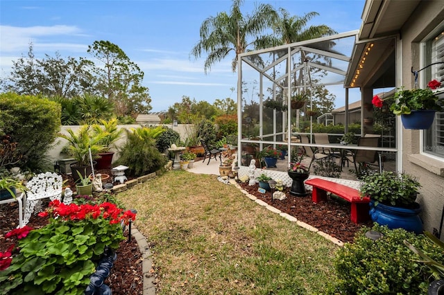 view of yard with a lanai and a patio area