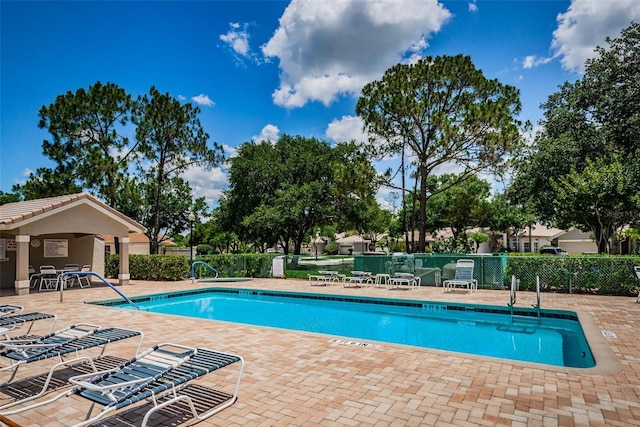 view of swimming pool with a patio area