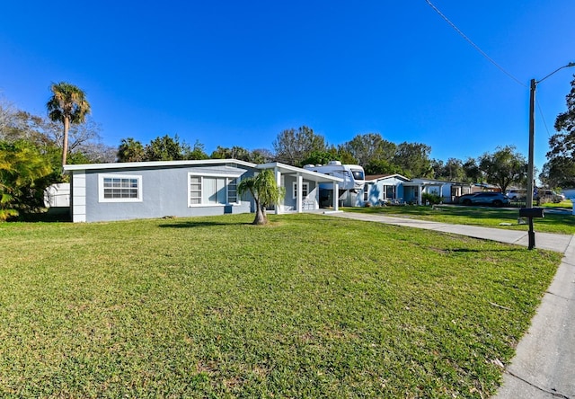 ranch-style home with a front yard