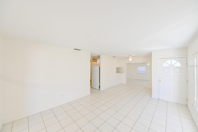 unfurnished room featuring ceiling fan and light tile patterned floors