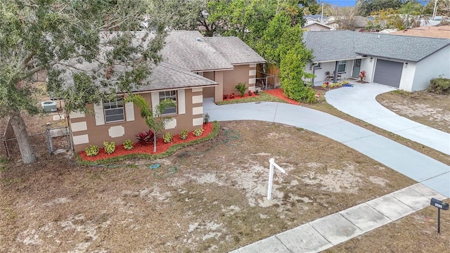 single story home featuring a garage