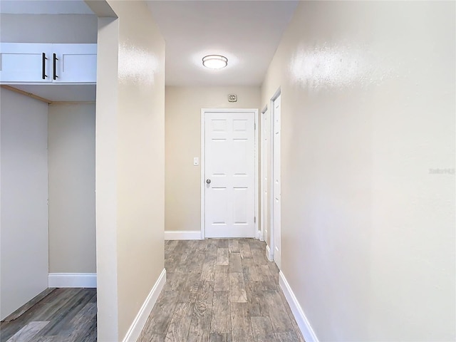 hall with dark hardwood / wood-style floors