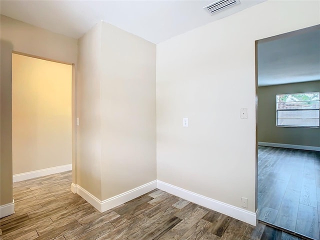 unfurnished room featuring wood-type flooring