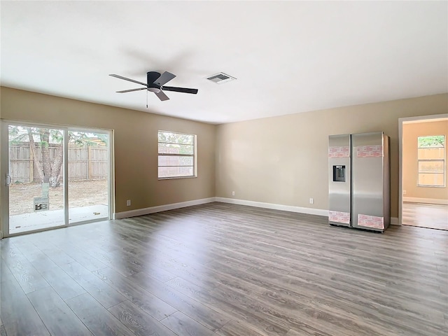 spare room with ceiling fan and wood-type flooring