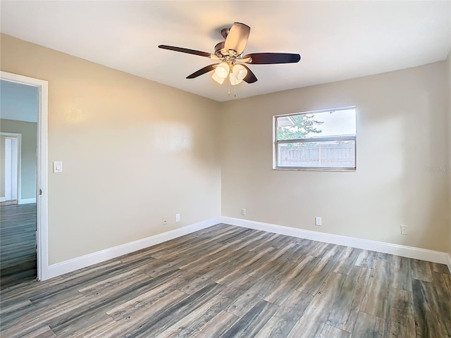 empty room featuring dark hardwood / wood-style floors and ceiling fan