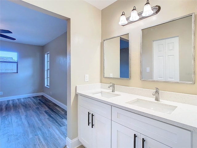 bathroom featuring vanity, ceiling fan, and hardwood / wood-style flooring