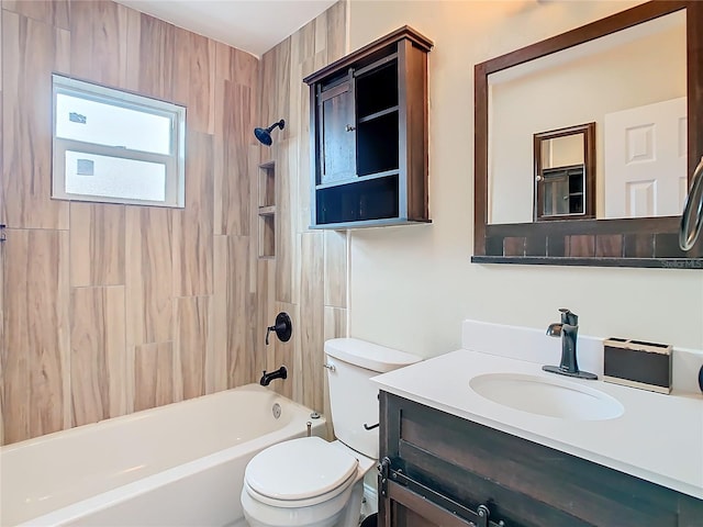 full bathroom with tiled shower / bath combo, toilet, and vanity