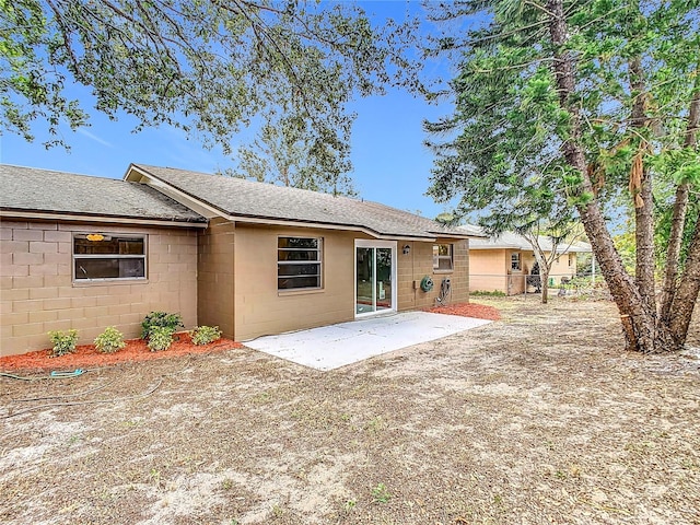 back of property with a patio area