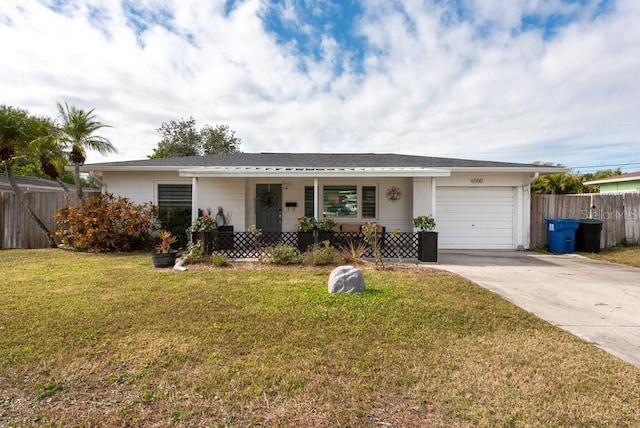 single story home featuring a front lawn, a garage, and covered porch