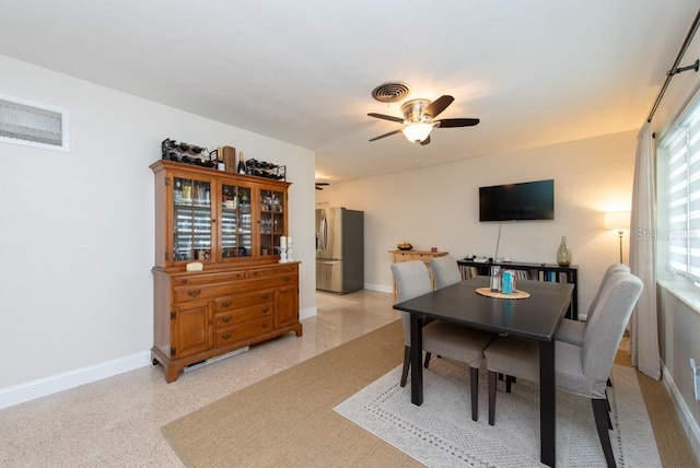 dining room featuring ceiling fan