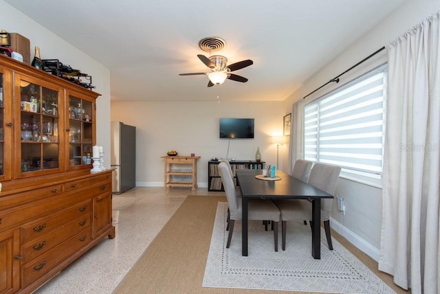 dining space with ceiling fan