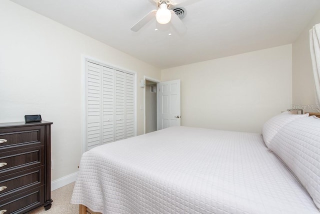 bedroom with ceiling fan and a closet