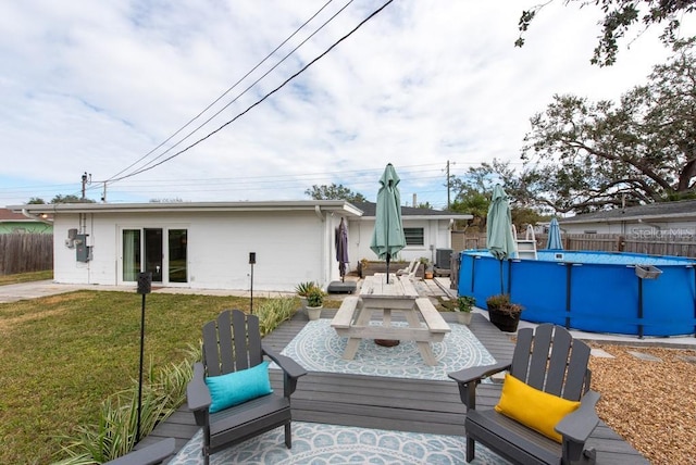 exterior space featuring a fenced in pool and a yard