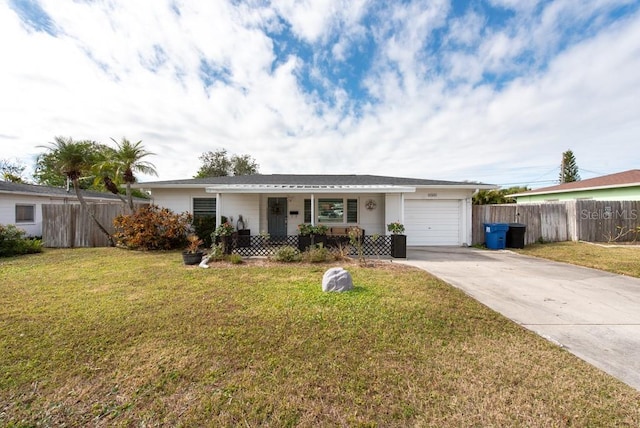 single story home with a garage, a front lawn, and a porch