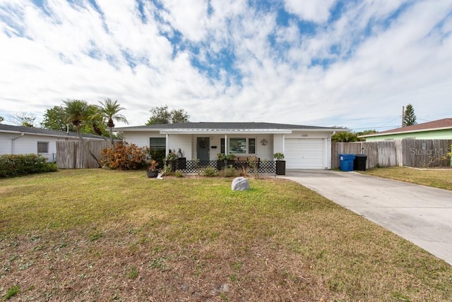 ranch-style home featuring a garage and a front yard