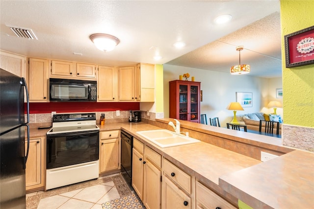 kitchen with pendant lighting, black appliances, light brown cabinetry, sink, and light tile patterned floors