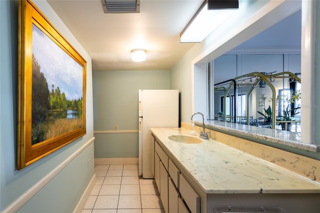 bathroom with vanity and tile patterned flooring