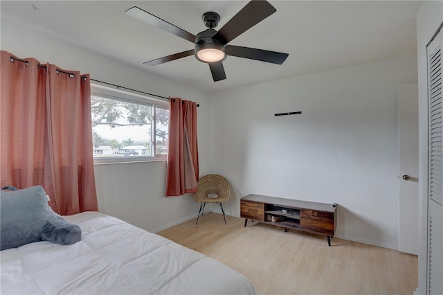 bedroom with light wood-type flooring and ceiling fan