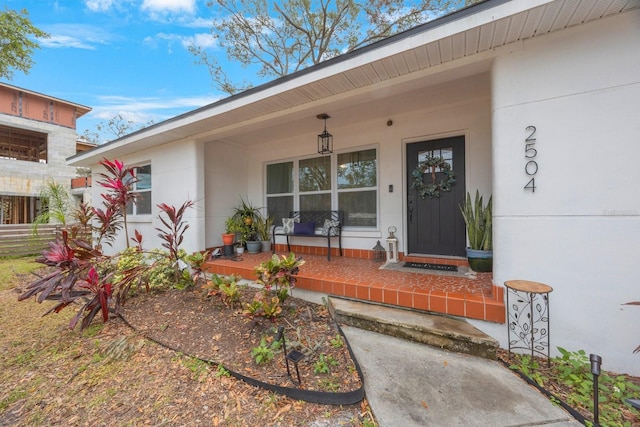 property entrance featuring a porch