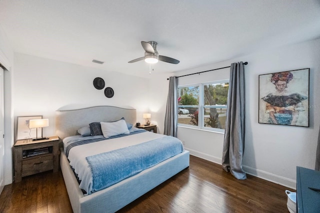 bedroom featuring ceiling fan and dark hardwood / wood-style floors