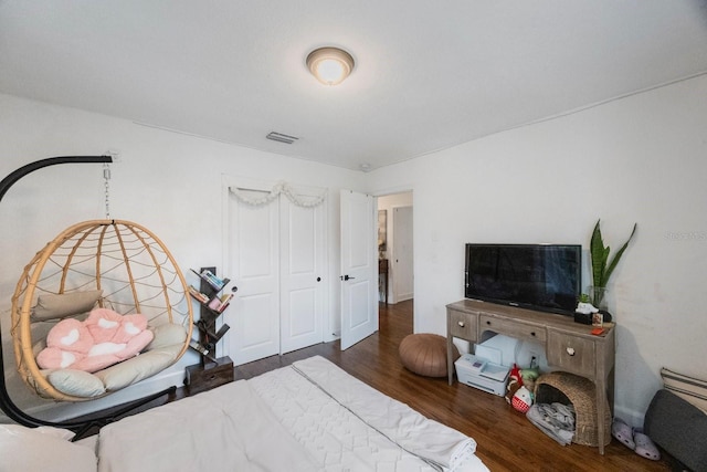 bedroom featuring dark hardwood / wood-style floors