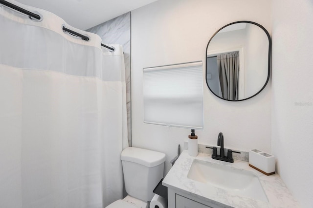 bathroom with toilet and vanity