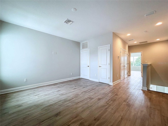 empty room featuring wood-type flooring