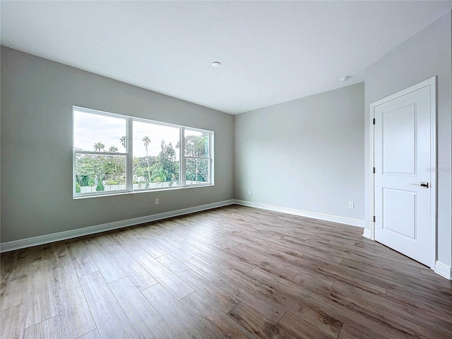 empty room featuring wood-type flooring