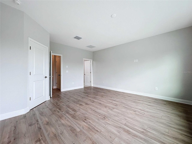 unfurnished room featuring light hardwood / wood-style flooring