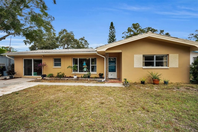 ranch-style home with a front yard