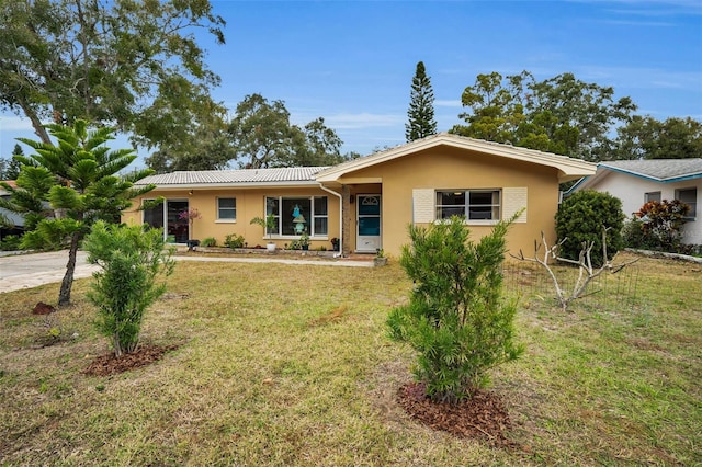 ranch-style house with a front yard