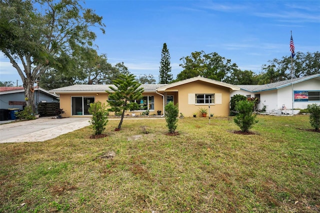 ranch-style house with a front yard